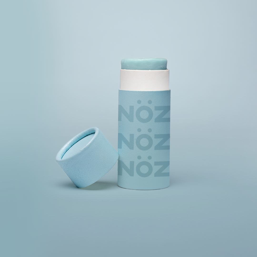 Front view of Neon blue  NOZ sunscreen stick with lid off 