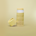 Load image into Gallery viewer, Front view of Neon yellow NOZ sunscreen stick with lid off 
