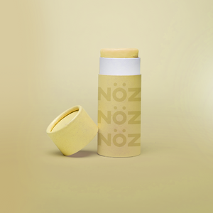 Front view of Neon yellow NOZ sunscreen stick with lid off 